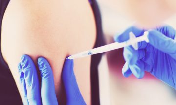 young person receiving vaccination