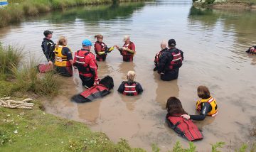 Rescue dogs help veterans improve their mental wellbeing through therapeutic open water swim sessions this summer