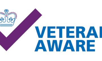 The Veteran Aware logo including a crown and a purple tick