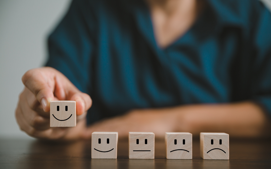 Happy and sad faces on cubes