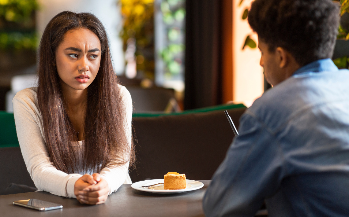 Unhappy female in discussion with support worker professional