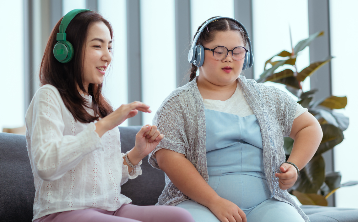 Two girls wearing headphones