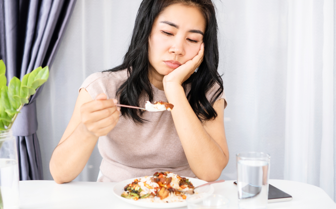 Adult looking at food not interested in eating