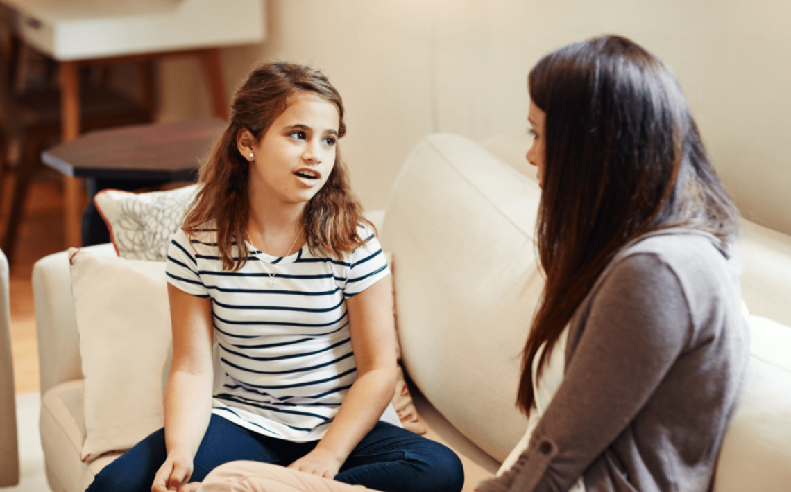 Mum talking to child at home