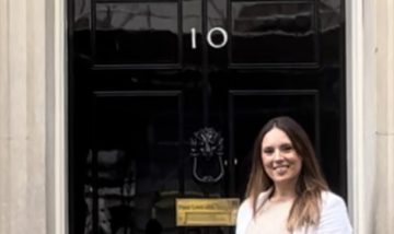 Photo of Kayleanne Payne outside the door to 10 Downing Street