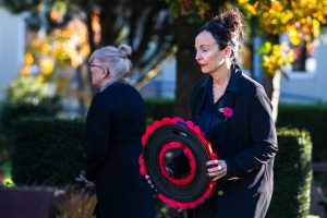 Angela Hillery laying a wreath.