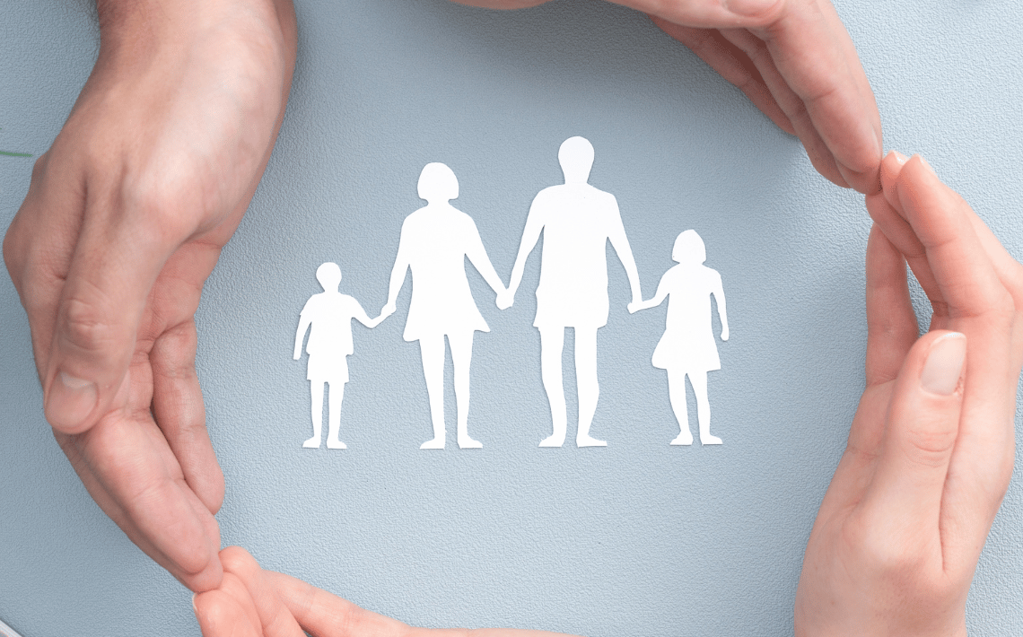 hands with white family picture in middle