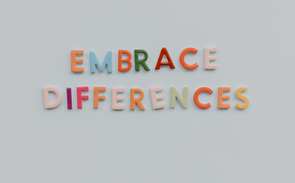Multi coloured words saying 'Embrace Differences'