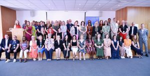 A group of around 70  people smiling at the camera at the Long Service Awards