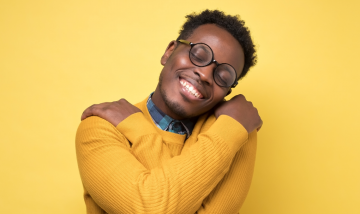 Man hugging himself for self love.