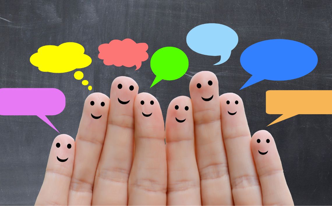 fingers with smiley faces and speech bubbles
